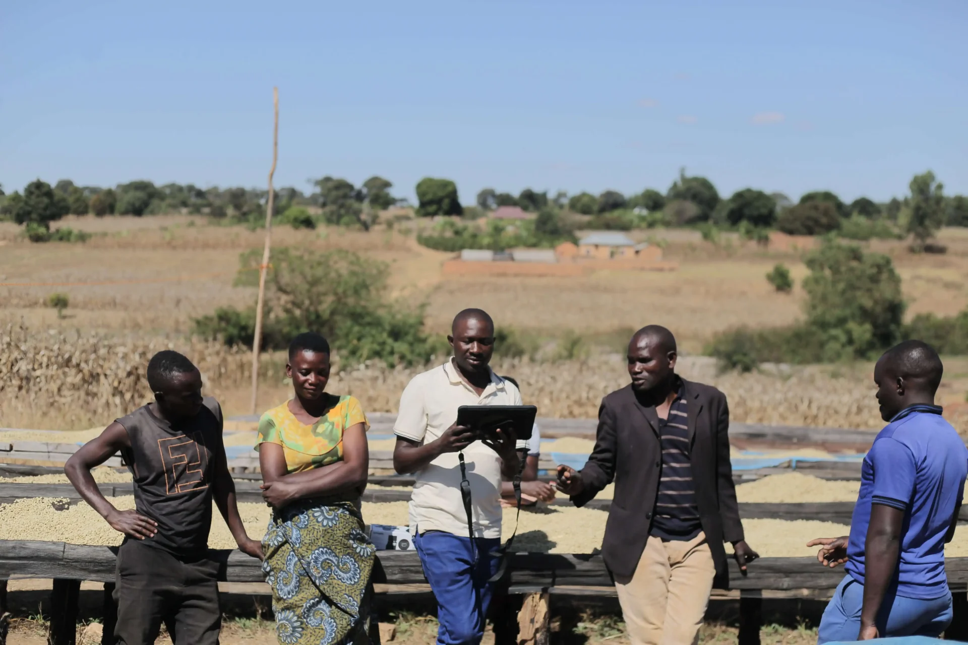 Field officer recording farmer and lot data on a tablet for lot-level traceability